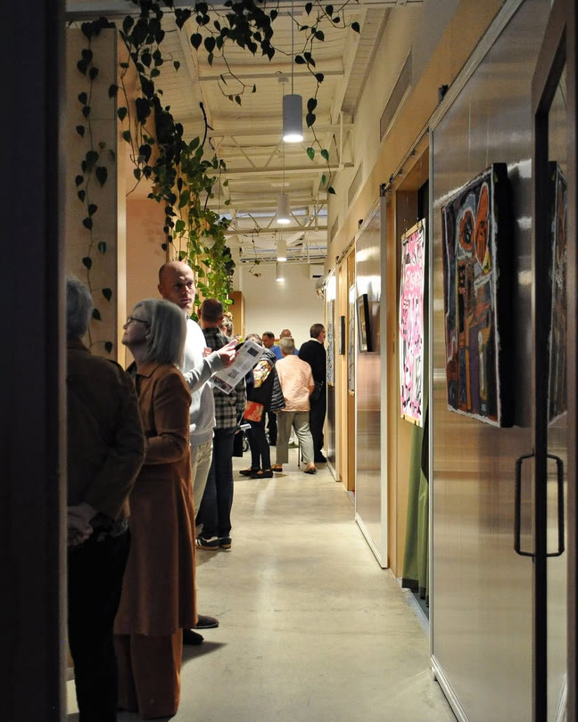 A long corridor hung with artworks